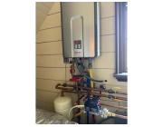 Expert Installing a Tankless Water Heater for Energy-Efficient Hot Water